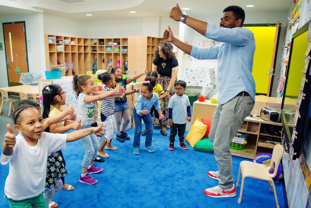 A Head Start program teacher uses a Kindermusik song to transition students from one activity to the next.