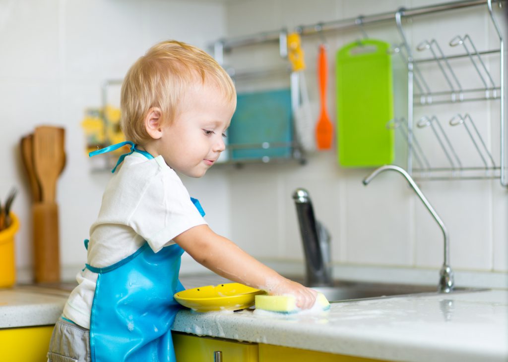 Young child washing dishes - 5 Ways to Balance Work-from-Home AND Parent-from-Home